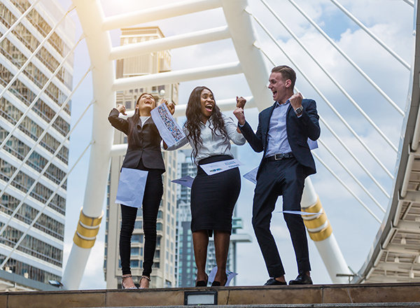 High-achieving professionals collaborating with confidence